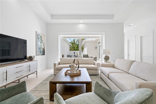 living room with a tray ceiling