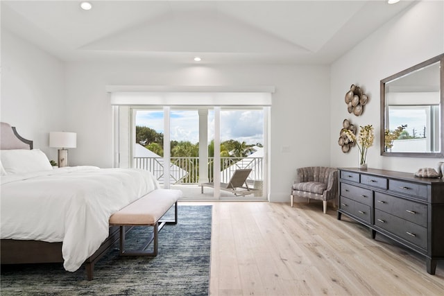 bedroom with access to exterior, lofted ceiling, and light wood-type flooring