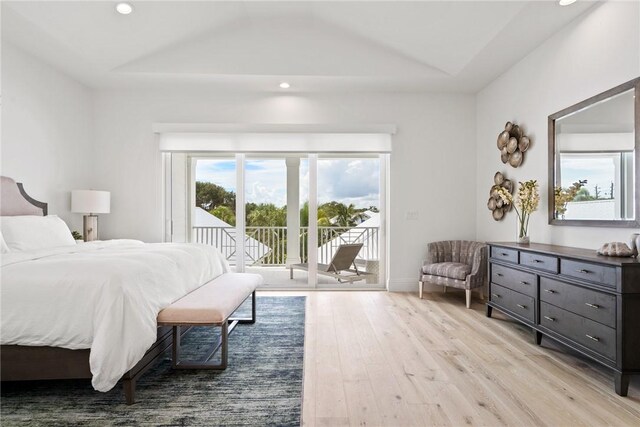 20 Strand Dr, Vero Beach, FL 32963 - bedroom featuring access to outside, light wood-style flooring, recessed lighting, and vaulted ceiling
