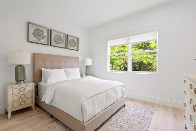 bedroom with light hardwood / wood-style flooring