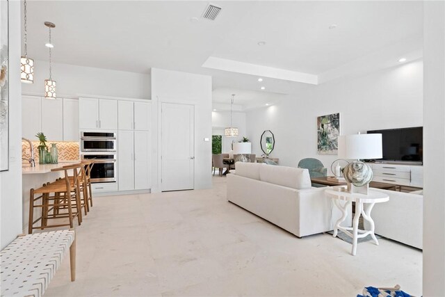 20 Strand Dr, Vero Beach, FL 32963 - living room featuring a tray ceiling and recessed lighting