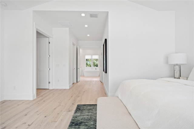 bedroom featuring light hardwood / wood-style floors