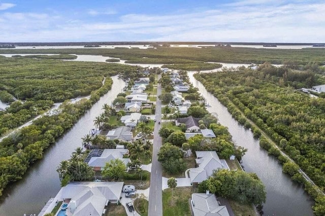 drone / aerial view featuring a water view and a residential view