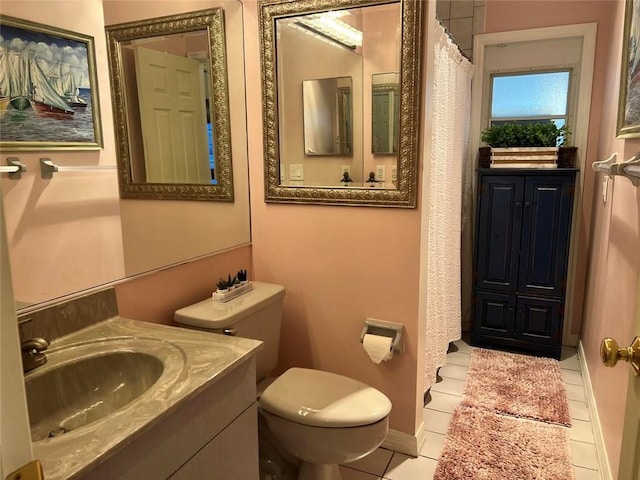 full bathroom with vanity, toilet, and tile patterned floors