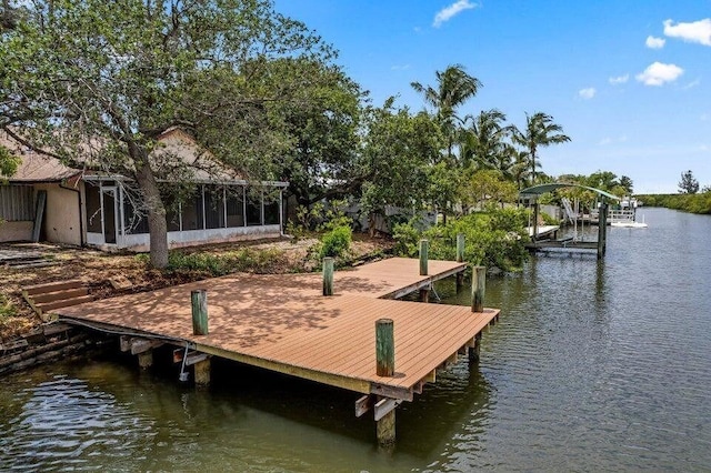 dock area featuring a water view and boat lift