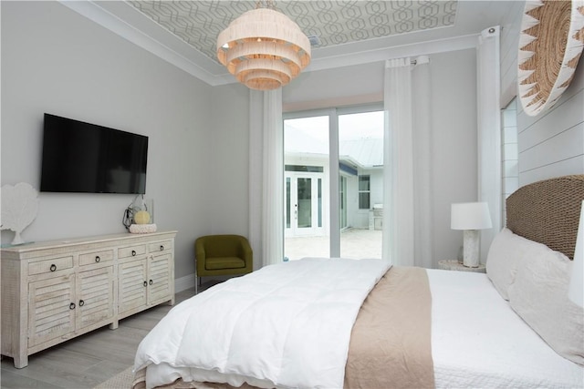 95 Strand Dr, Vero Beach, FL 32963 - bedroom with an ornate ceiling, light wood-style floors, access to outside, and crown molding