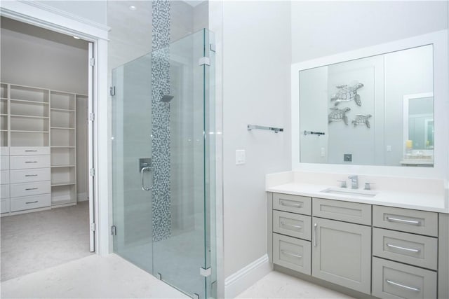 95 Strand Dr, Vero Beach, FL 32963 - bathroom with vanity, a stall shower, and a spacious closet