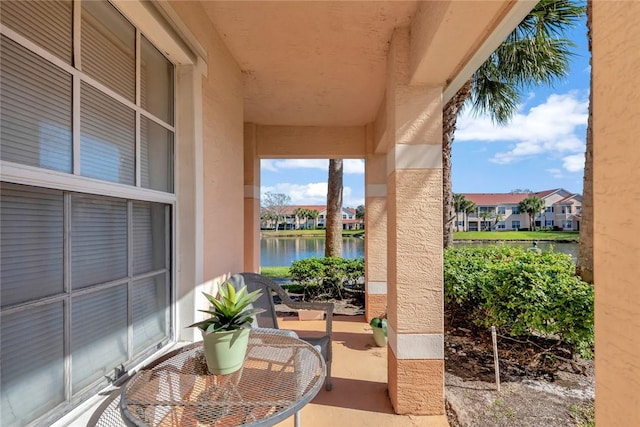 view of patio featuring a water view