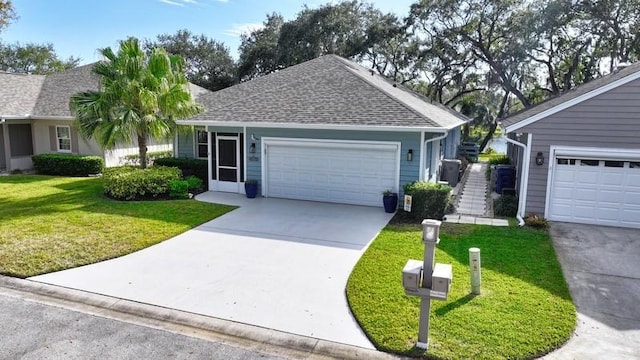 ranch-style home featuring a front yard and a garage