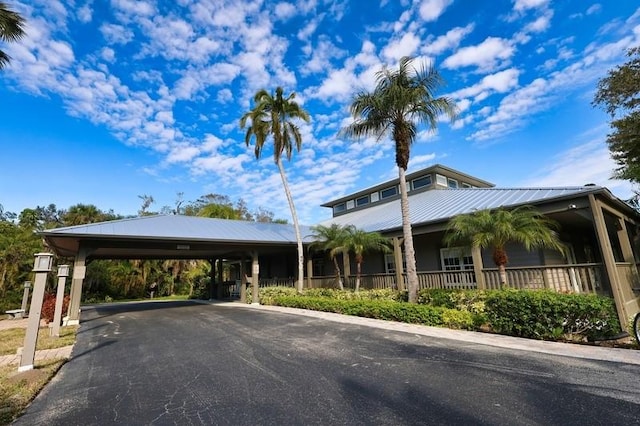 exterior space with a carport