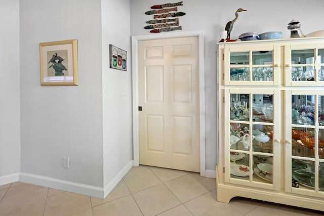 doorway featuring light tile patterned floors