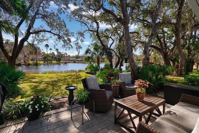 view of patio featuring a water view and an outdoor hangout area