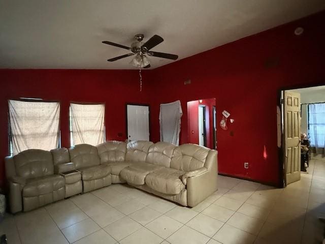 living room with a wealth of natural light and ceiling fan