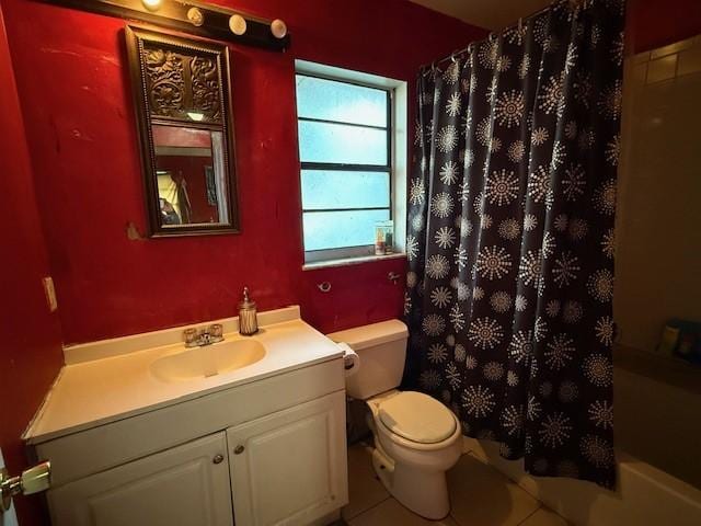 bathroom with vanity, tile patterned floors, and toilet