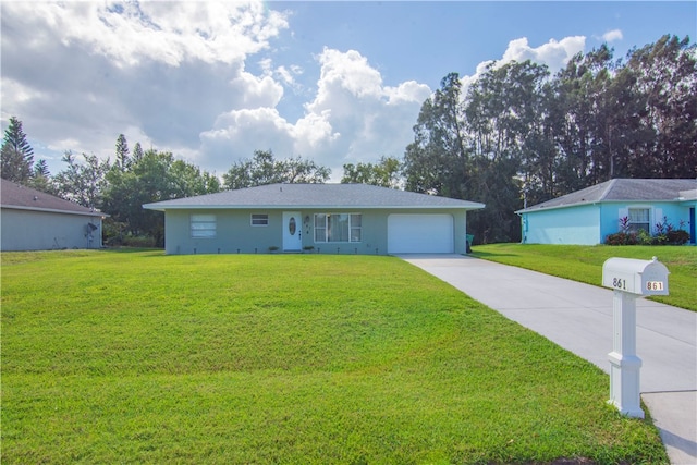 single story home with a garage and a front lawn