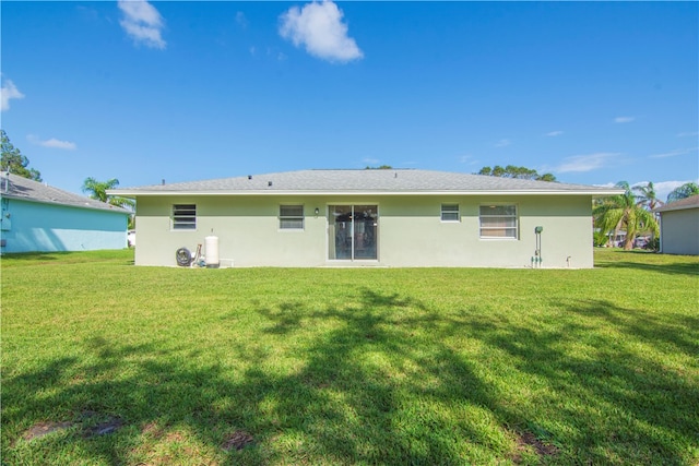 back of house with a yard