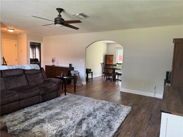 bedroom featuring hardwood / wood-style flooring, ceiling fan, and a closet