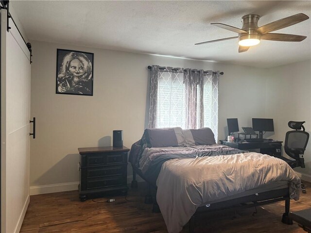 dining space with hardwood / wood-style floors and a textured ceiling