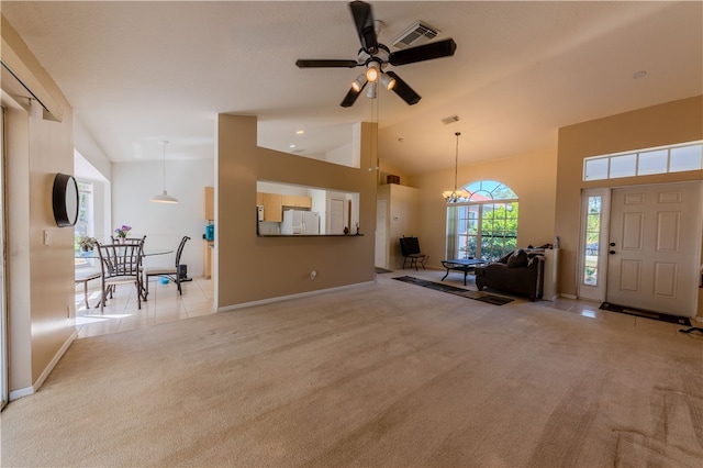 living room featuring light colored carpet, ceiling fan with notable chandelier, and high vaulted ceiling