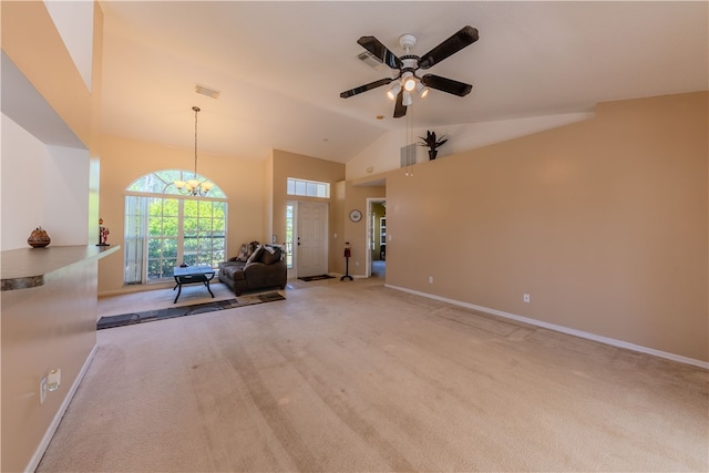 unfurnished living room featuring ceiling fan with notable chandelier, light colored carpet, and high vaulted ceiling