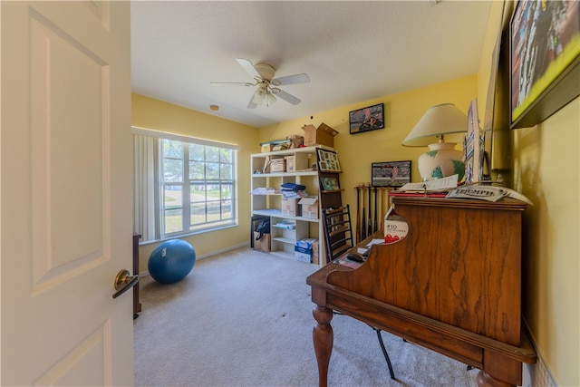 office area with ceiling fan and light colored carpet