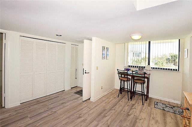 dining room with light hardwood / wood-style flooring