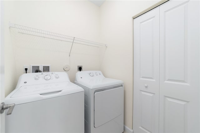 clothes washing area featuring washing machine and clothes dryer