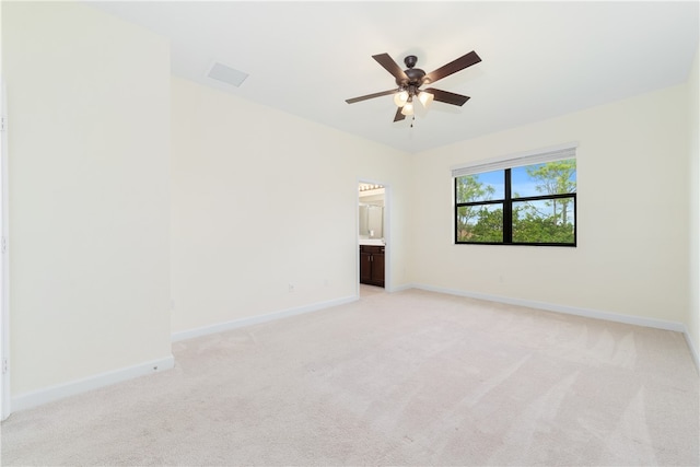 empty room with light carpet and ceiling fan