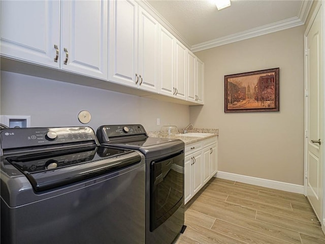 4836 Four Lakes Cir SW, Vero Beach, FL 32968 - laundry area featuring separate washer and dryer, crown molding, cabinet space, light wood-type flooring, and baseboards