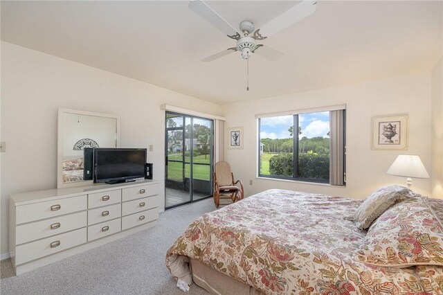 carpeted bedroom with access to outside and ceiling fan