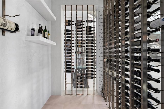 wine area featuring tile patterned flooring