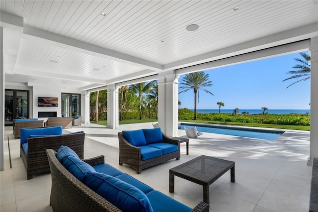 view of patio / terrace with an outdoor hangout area and a water view