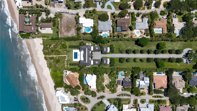 bird's eye view featuring a beach view and a water view