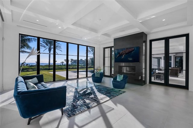 living room featuring french doors, coffered ceiling, and beam ceiling