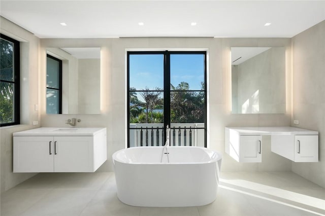 bathroom with a bath and vanity