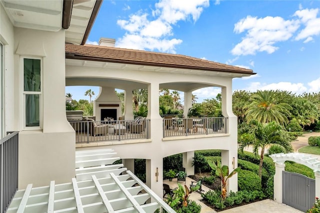 view of patio / terrace with an outdoor fireplace