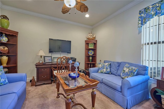 living room with crown molding, light colored carpet, and ceiling fan