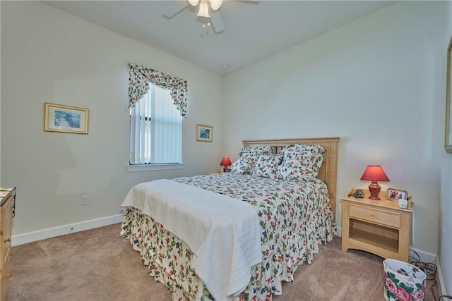 bedroom with ceiling fan and light carpet