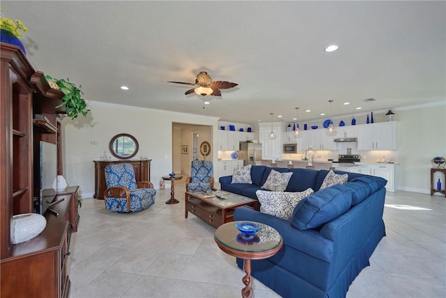 tiled living room featuring ceiling fan and ornamental molding