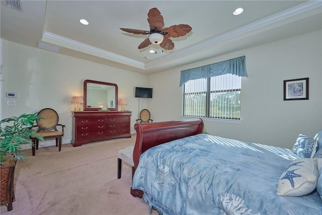 bedroom with a raised ceiling, ornamental molding, light carpet, and ceiling fan