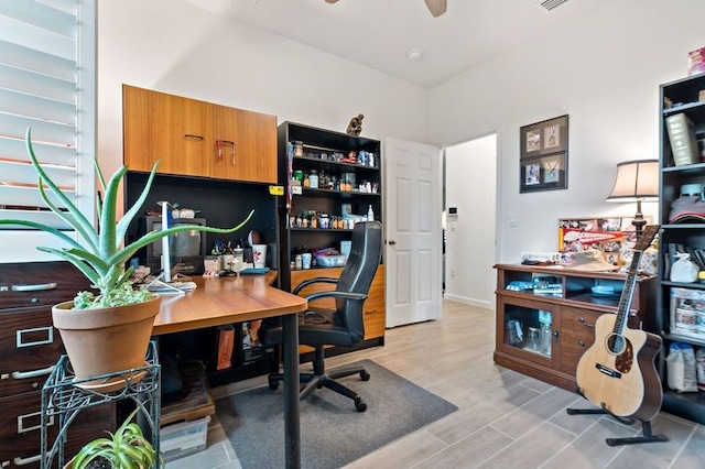 office area with light wood-type flooring and ceiling fan