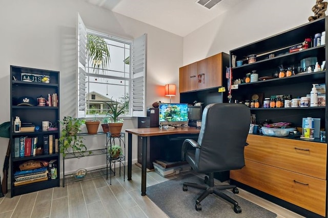 office featuring a wealth of natural light and light hardwood / wood-style floors