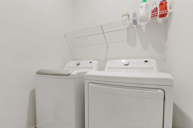 laundry room featuring washing machine and dryer