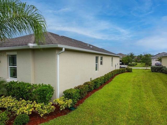 view of property exterior featuring a yard