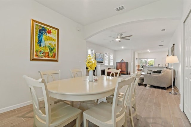 dining room featuring light wood-type flooring and ceiling fan