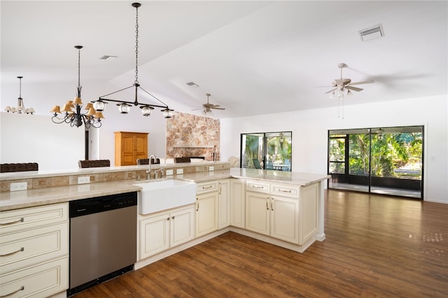 kitchen with cream cabinets, sink, stainless steel dishwasher, decorative light fixtures, and dark hardwood / wood-style flooring