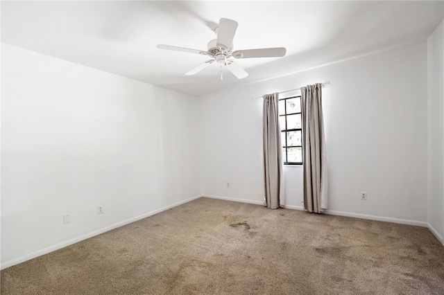 unfurnished room featuring carpet flooring and ceiling fan