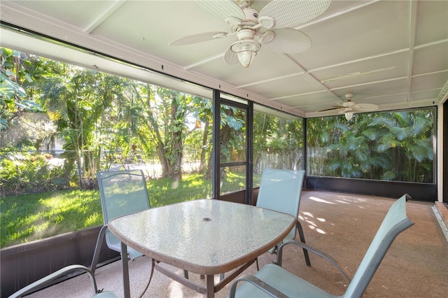 sunroom / solarium featuring ceiling fan