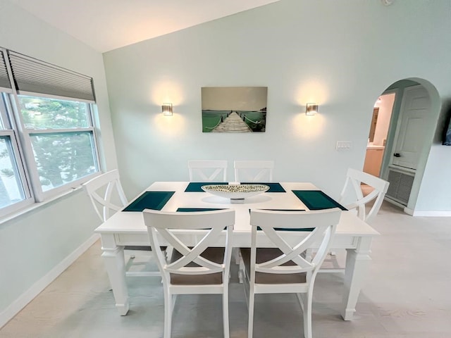 dining room with vaulted ceiling