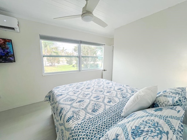 bedroom with an AC wall unit and ceiling fan